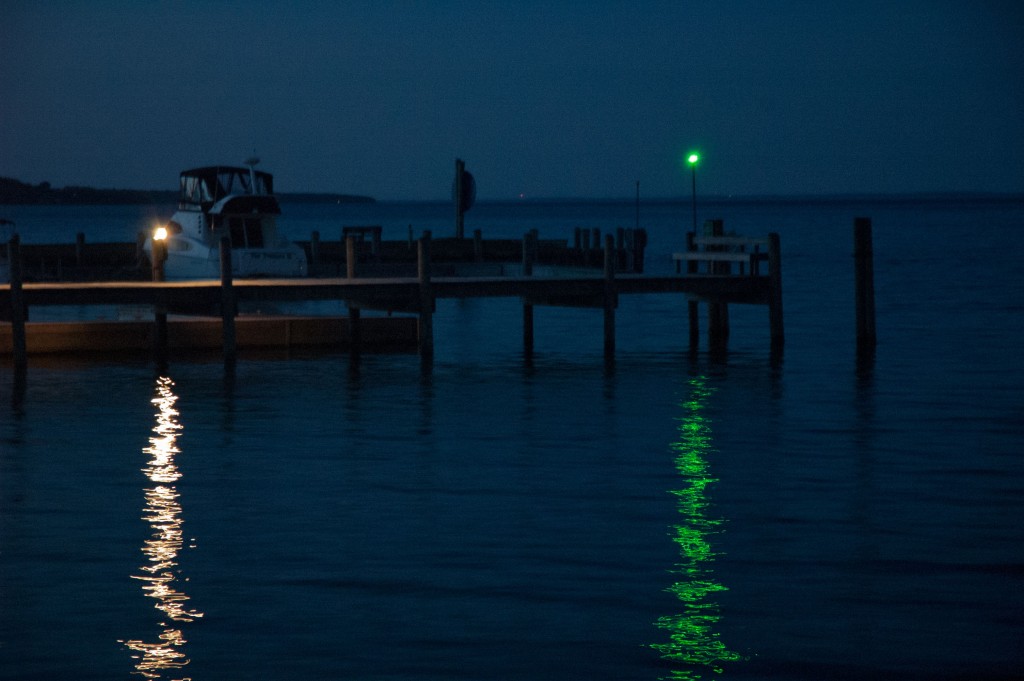 Green navigation light on water